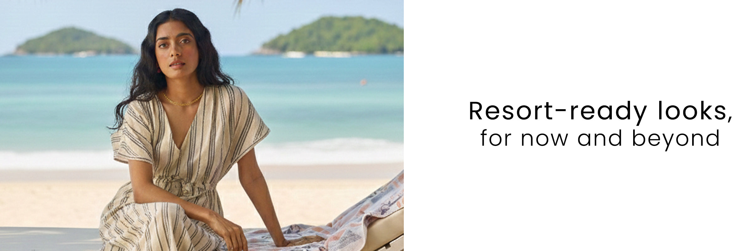 Woman wearing a relaxed neutral summer dress sitting by the beach with “Resort-ready looks for now and beyond” style concept by Reistor.