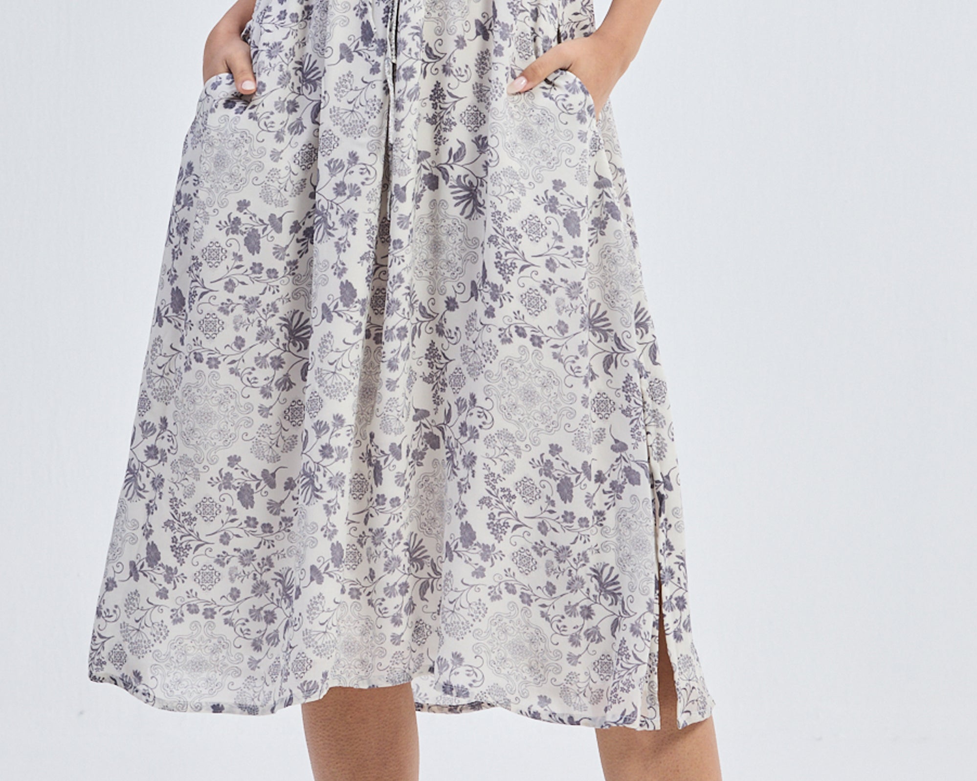 Deep_V-neck_Gathered_Dress_in_Florals_1.jpg