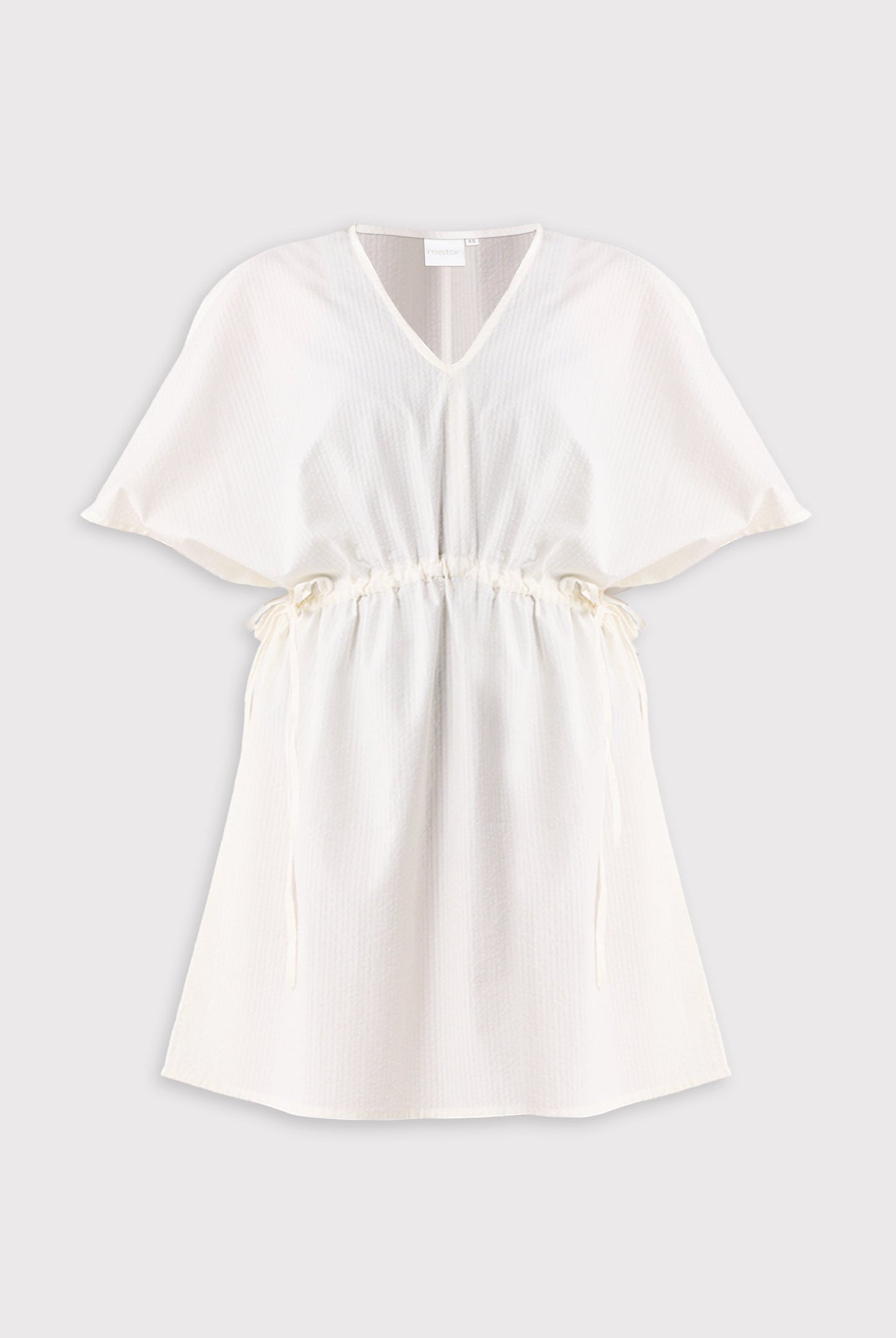 White cover up on a light gray background