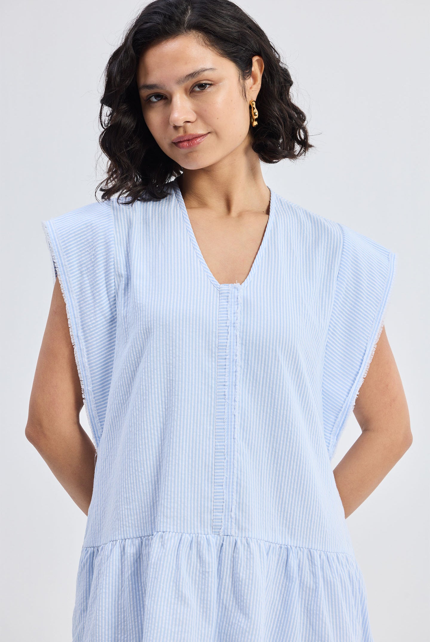 Oversized V neck Short Dress with Frayed Sleeves Closeup