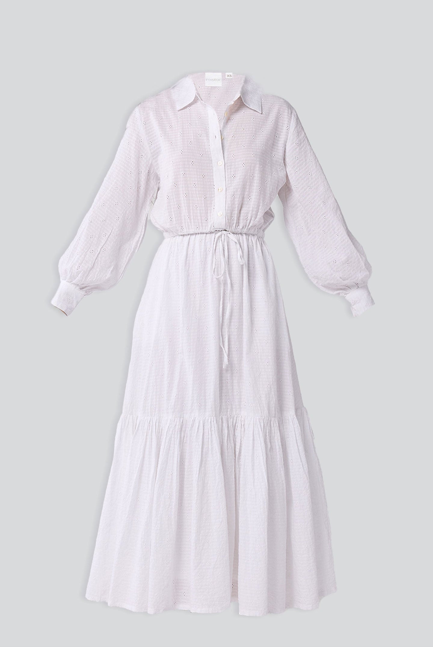 White dress with long sleeves on a light gray background