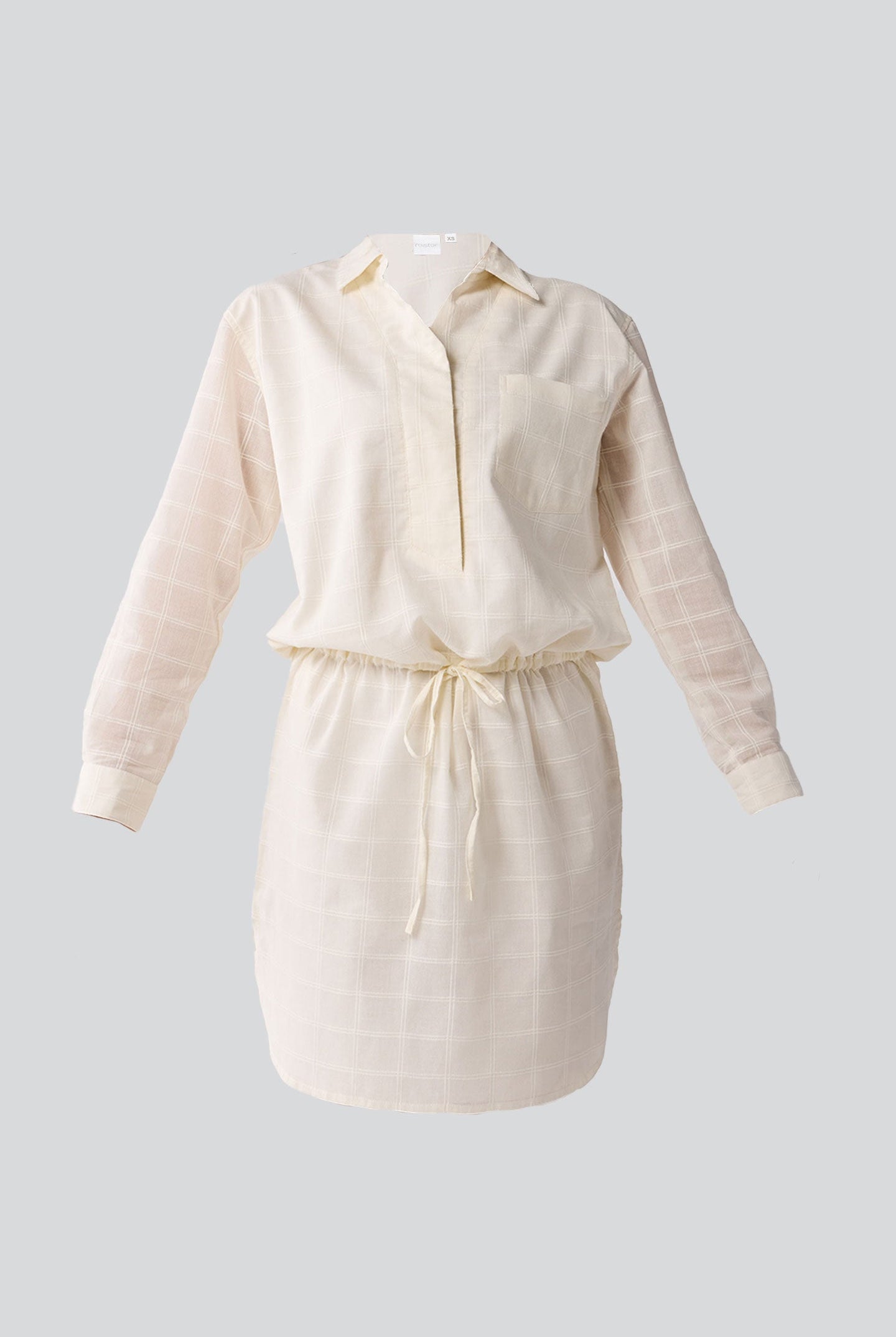 White dress with long sleeves on a light gray background