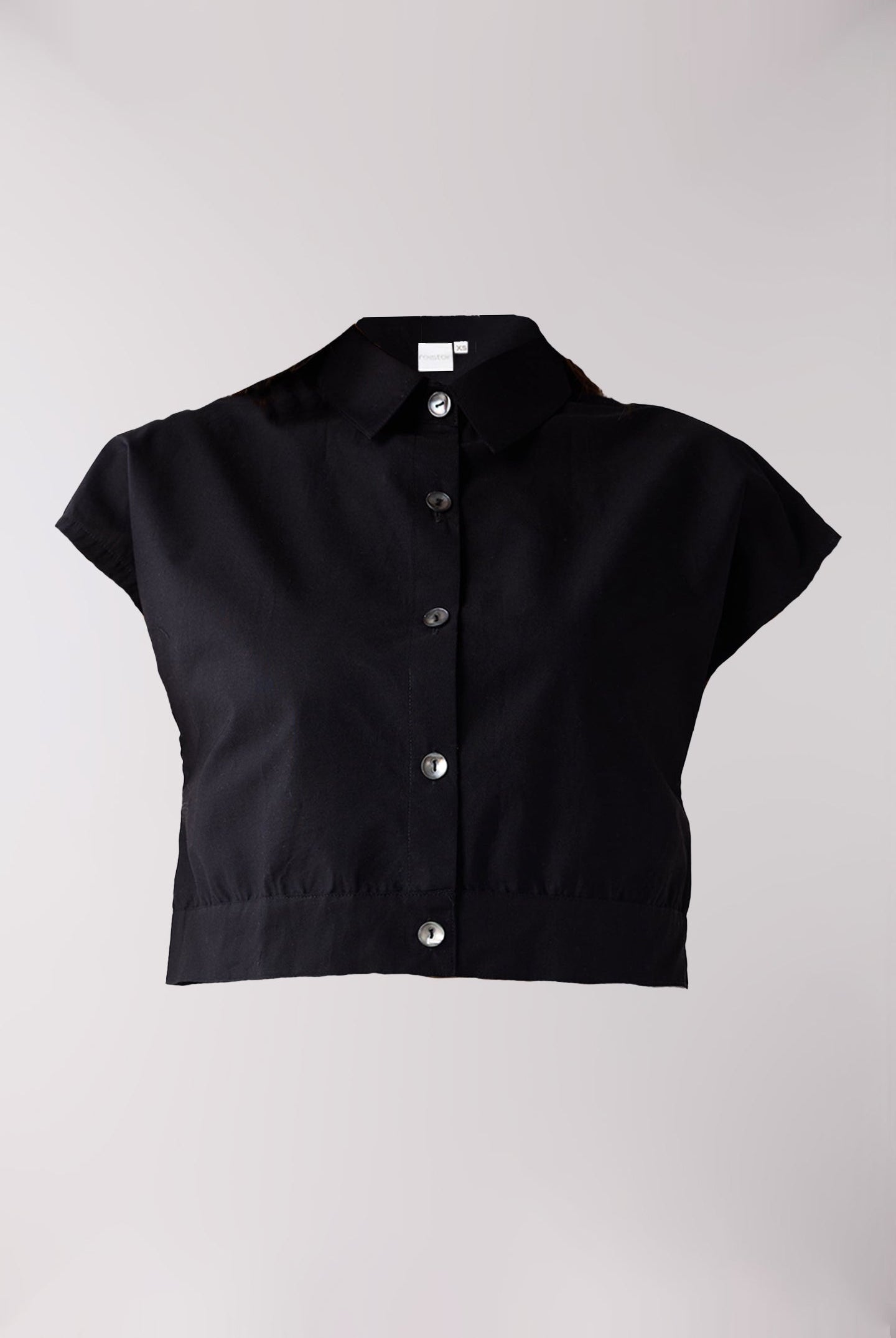 Black short-sleeve blouse with buttons on a light gray background