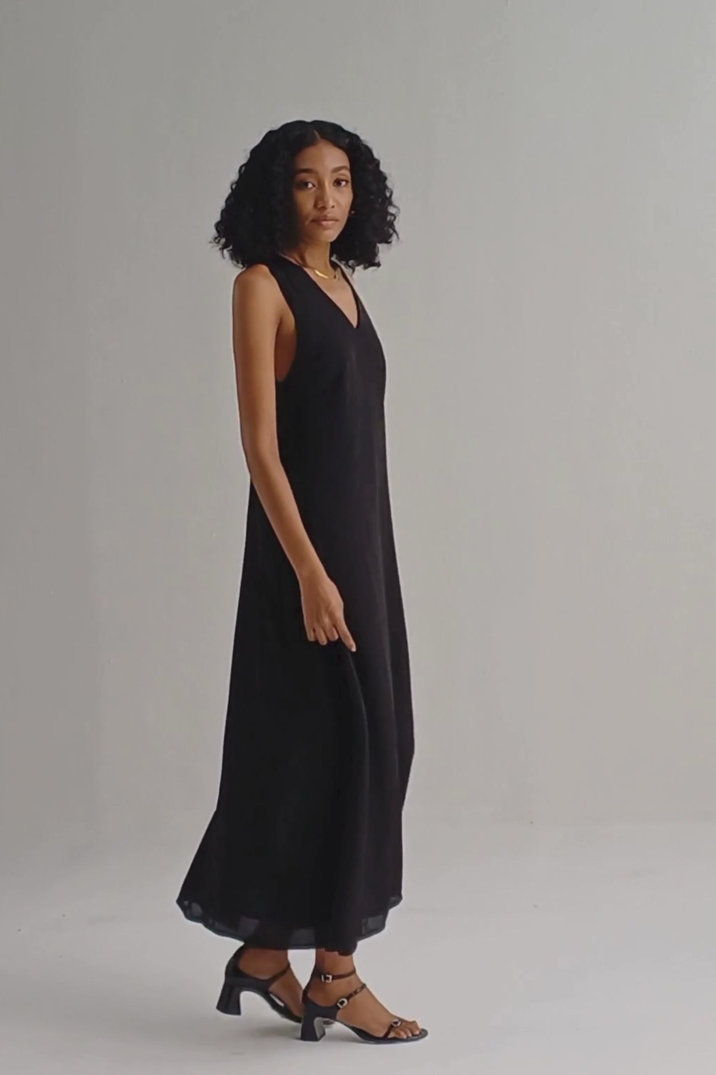 Crossed in Chic Sleeveless Maxi Dress in Black Moodshot Video