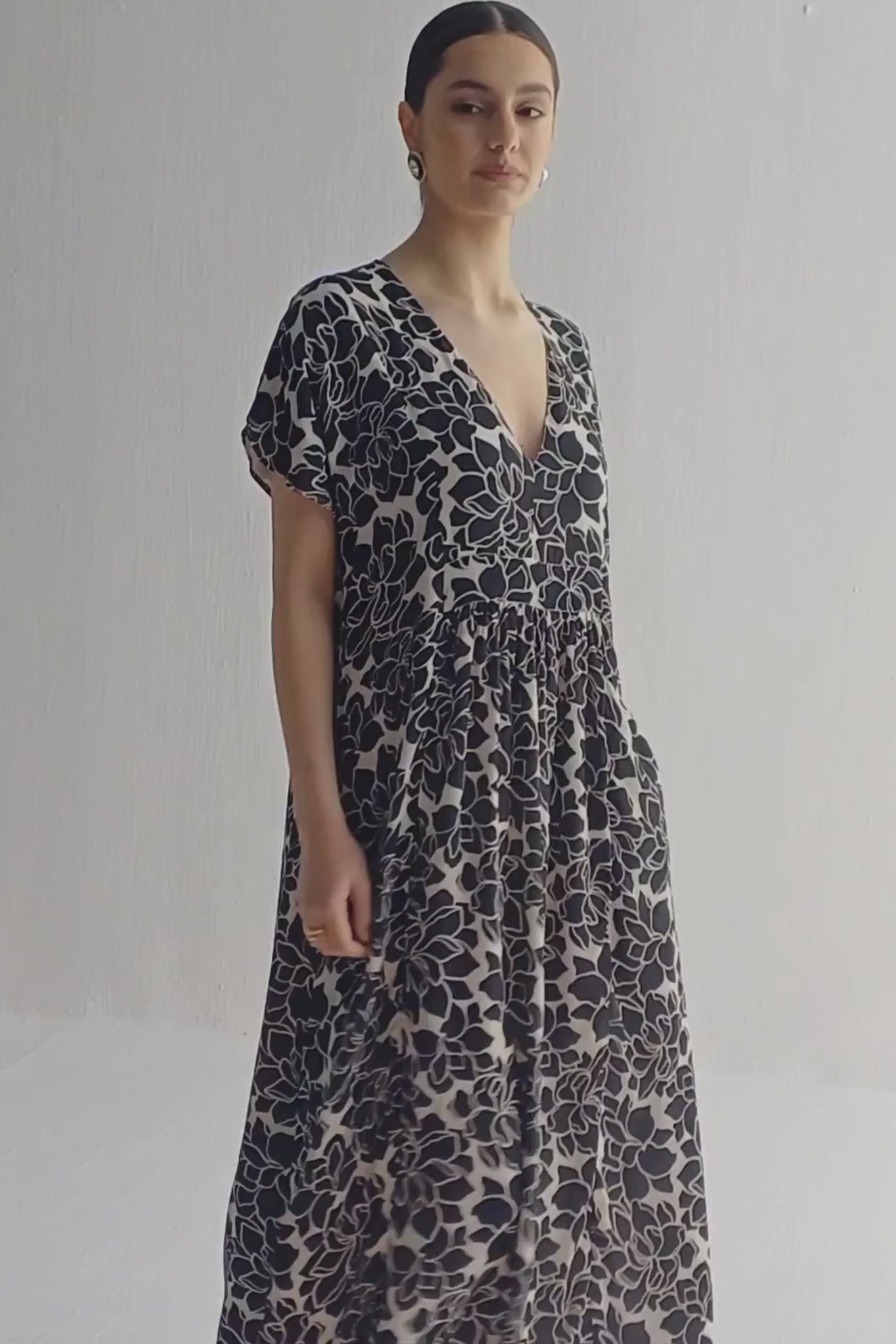 Deep V-neck Maxi Dress with Front Gathers in Black Florals Moodshot Video