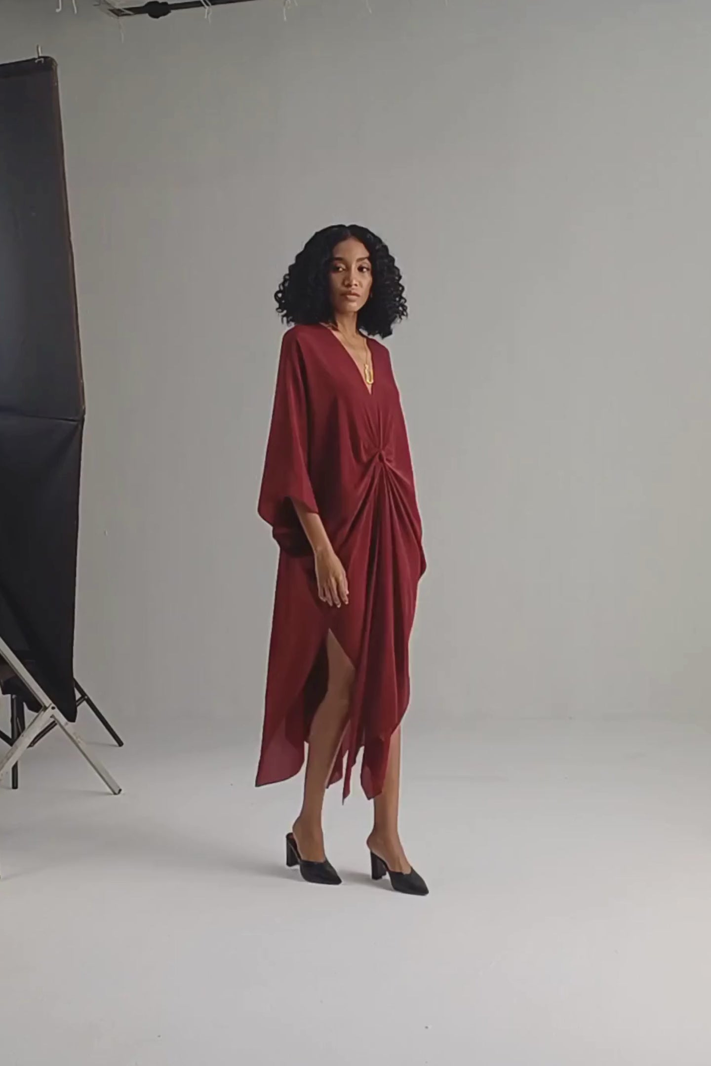 Front Twist Kaftan Dress in Burgundy moodshot Video
