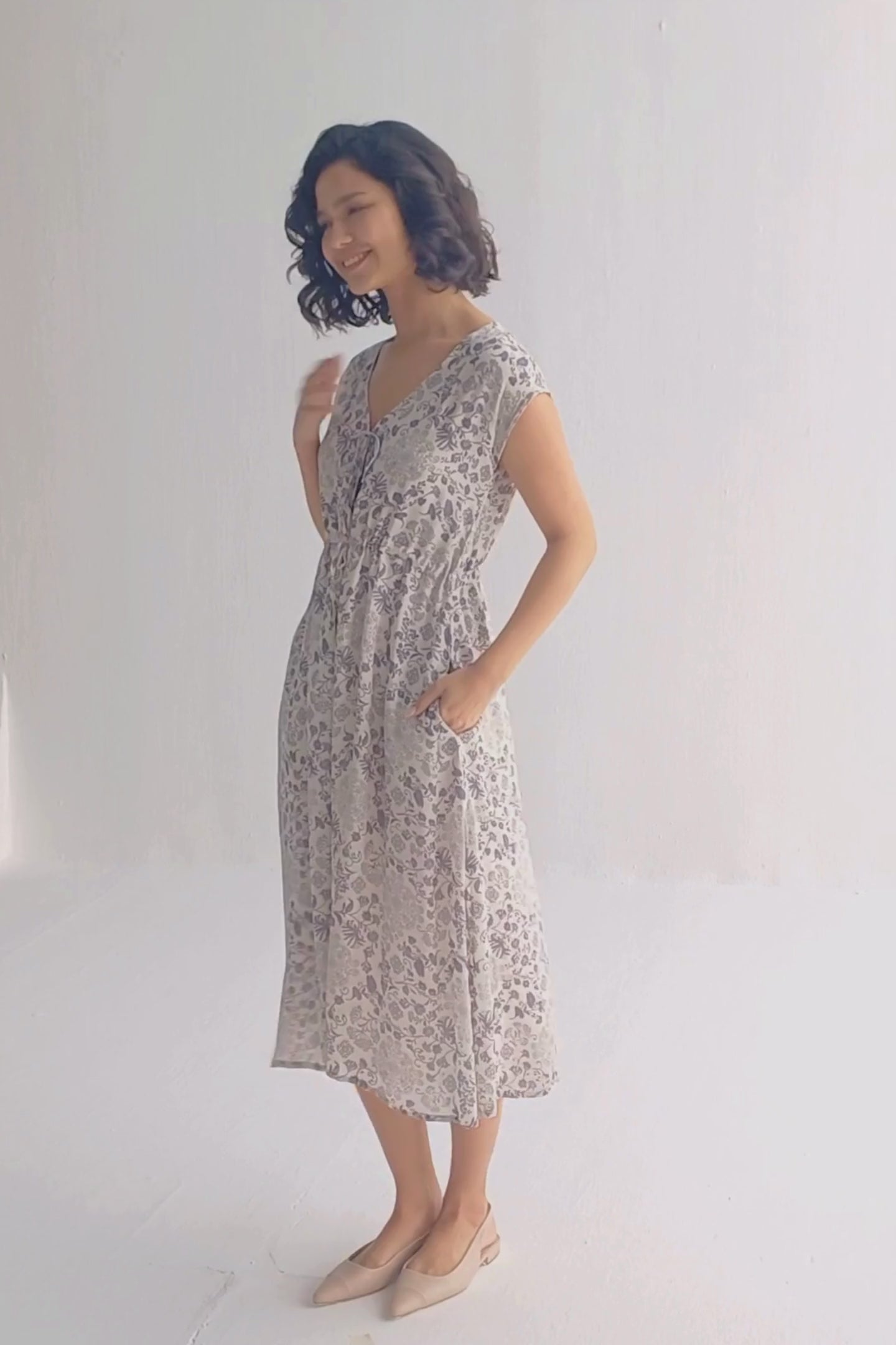 Deep V-neck Gathered Dress in Florals Moodshot Video