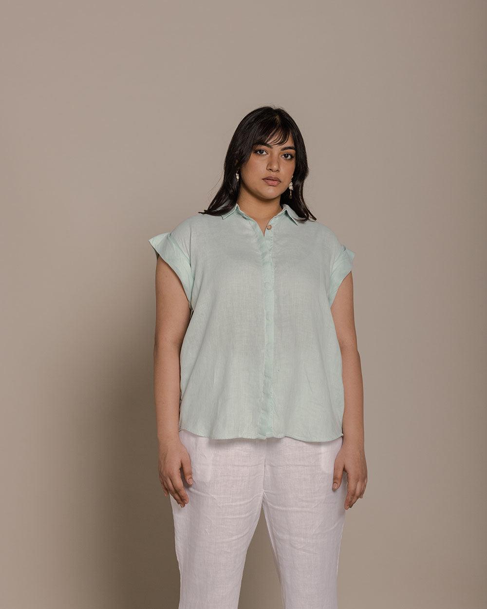 mint half sleeves shirt with detailing on the back that defines your silhouette. Reistor