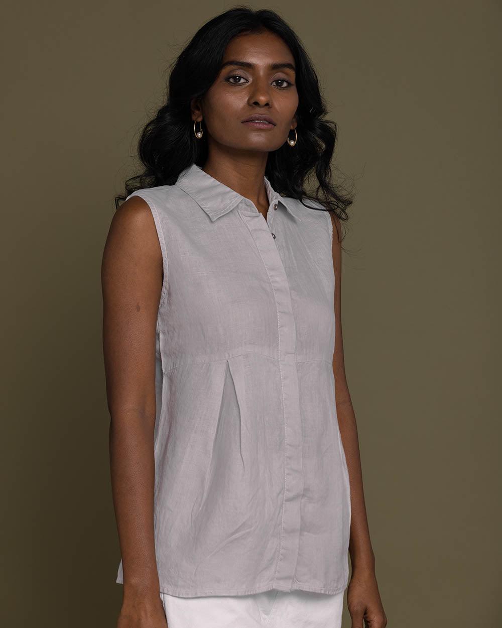grey sleeveless collared top with a hidden placket lends a sleek look to this classic top.