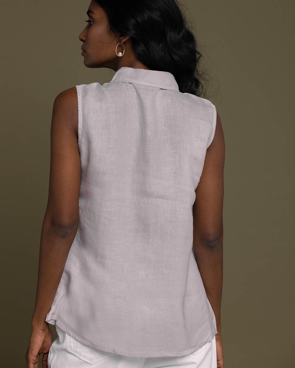 grey sleeveless collared top with a hidden placket lends a sleek look to this classic top.