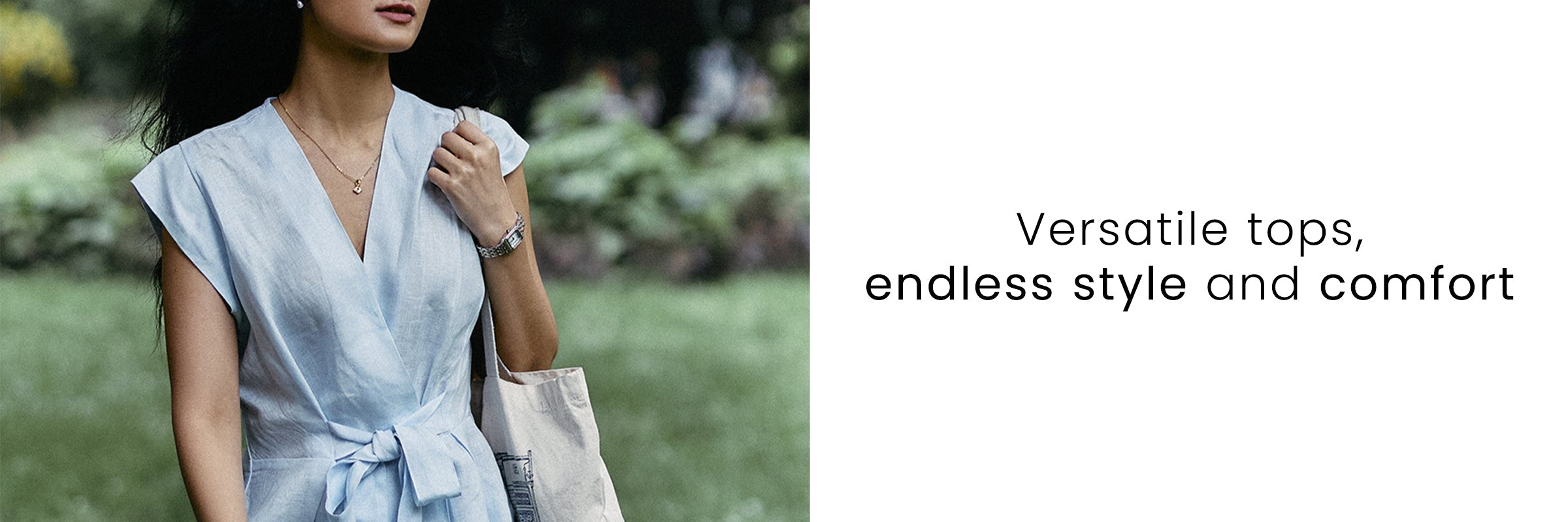 Woman wearing a light blue versatile wrap top, showcasing a comfortable and stylish everyday women’s top.