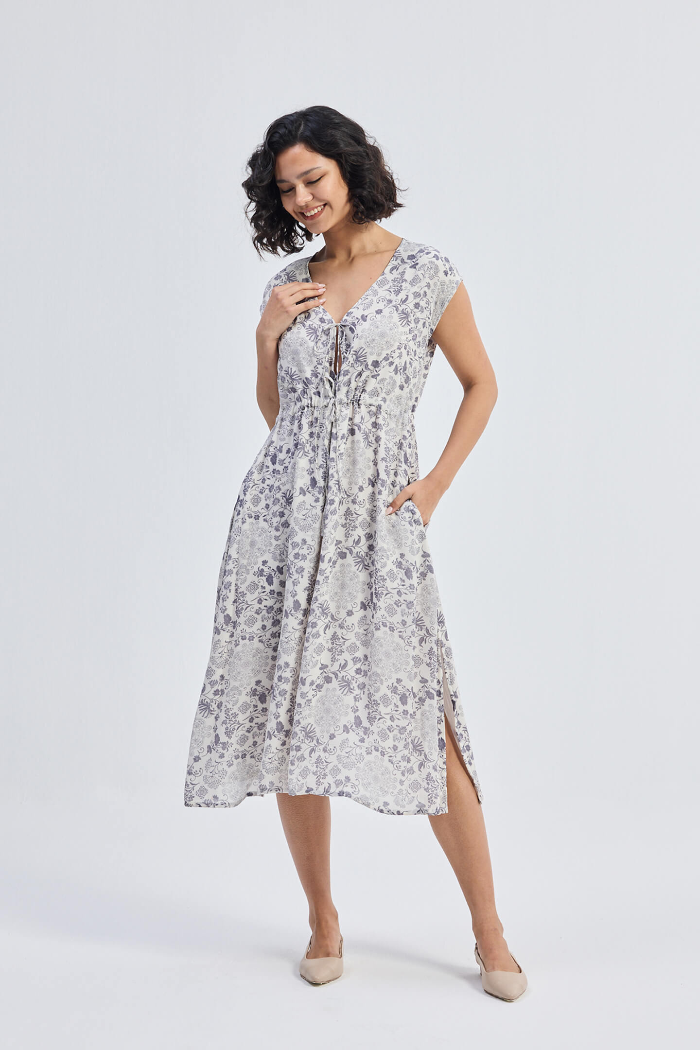 Deep V-neck Gathered Dress in Florals Moodshot