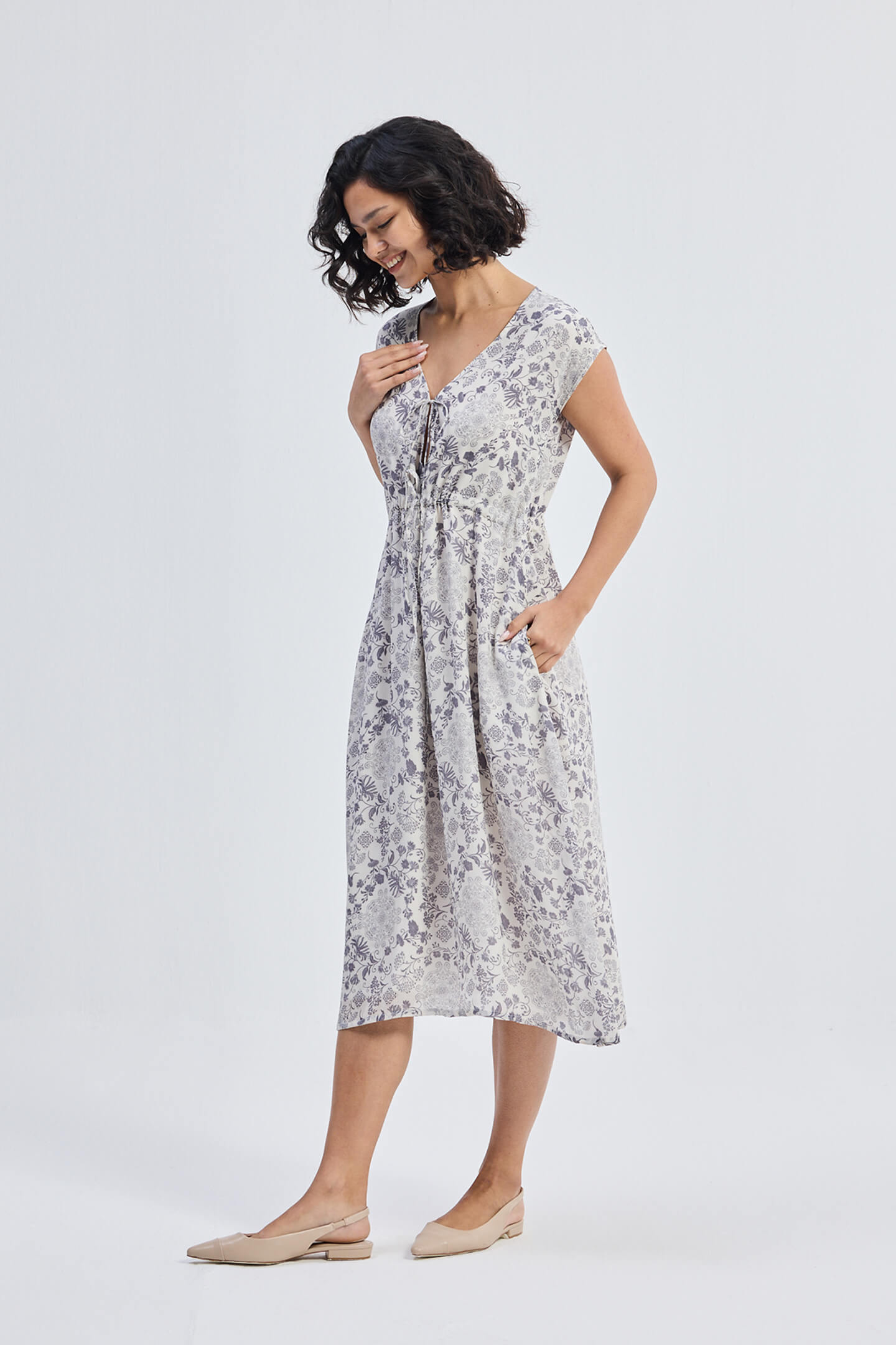 Deep V-neck Gathered Dress in Florals Moodshot