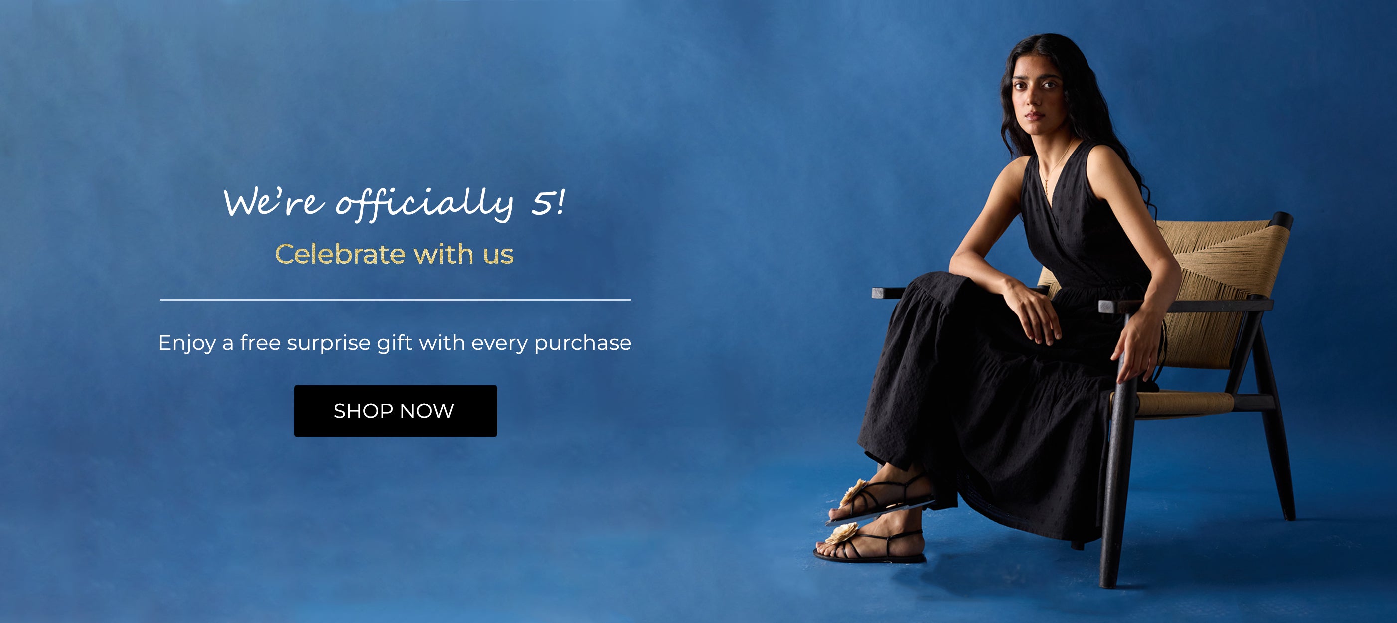 Woman in a black dress sitting on a chair against a blue background with promotional text.