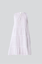 White tiered dress on a light gray background