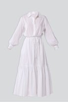 White dress with long sleeves on a light gray background