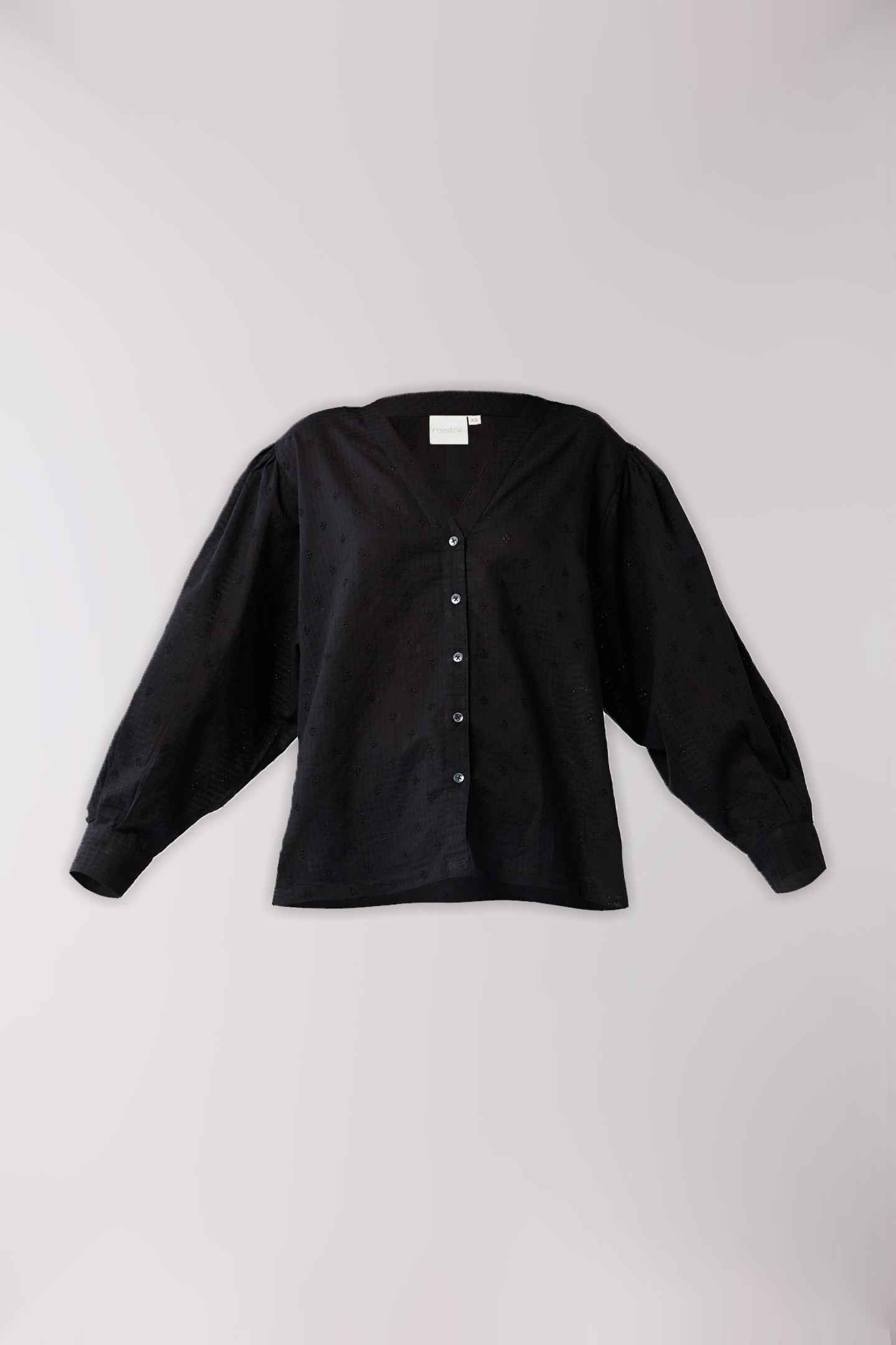 Black button-up shirt on a light gray background