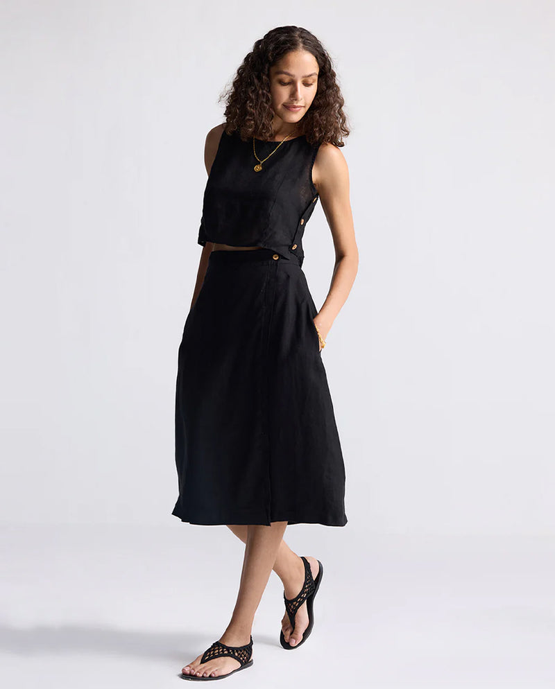Woman wearing a black dress on a white background