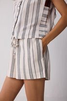 Striped shorts with a matching top on a neutral background