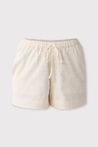 Off-white shorts with a drawstring on a light gray background