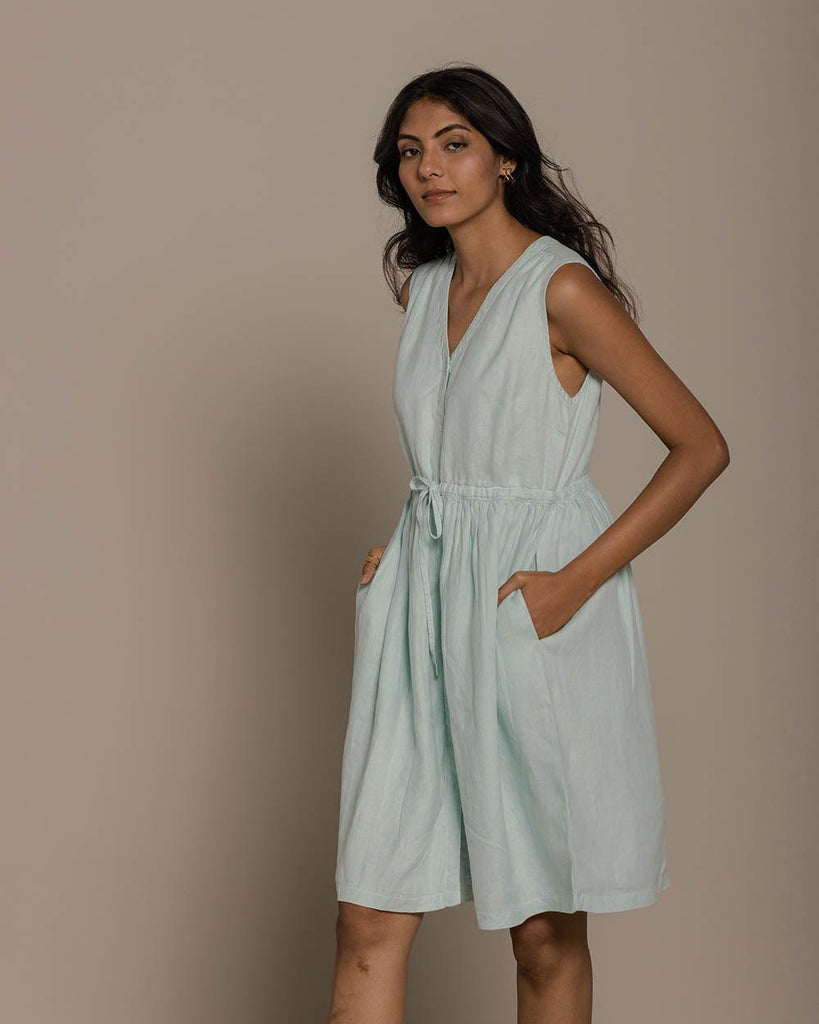 mint buttoned down sleeveless dress with a drawstring at the waist to give it more definition