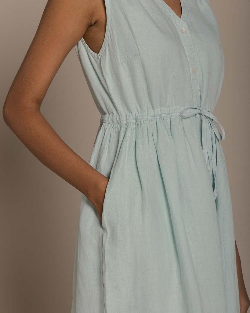 functional mint mid length sleeveless dress with a drawstring to define the waistline and buttons