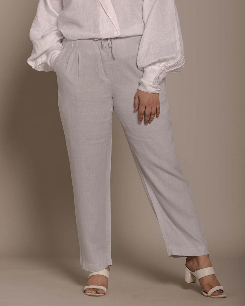 straight grey pants with pockets and a drawstring at the waist.