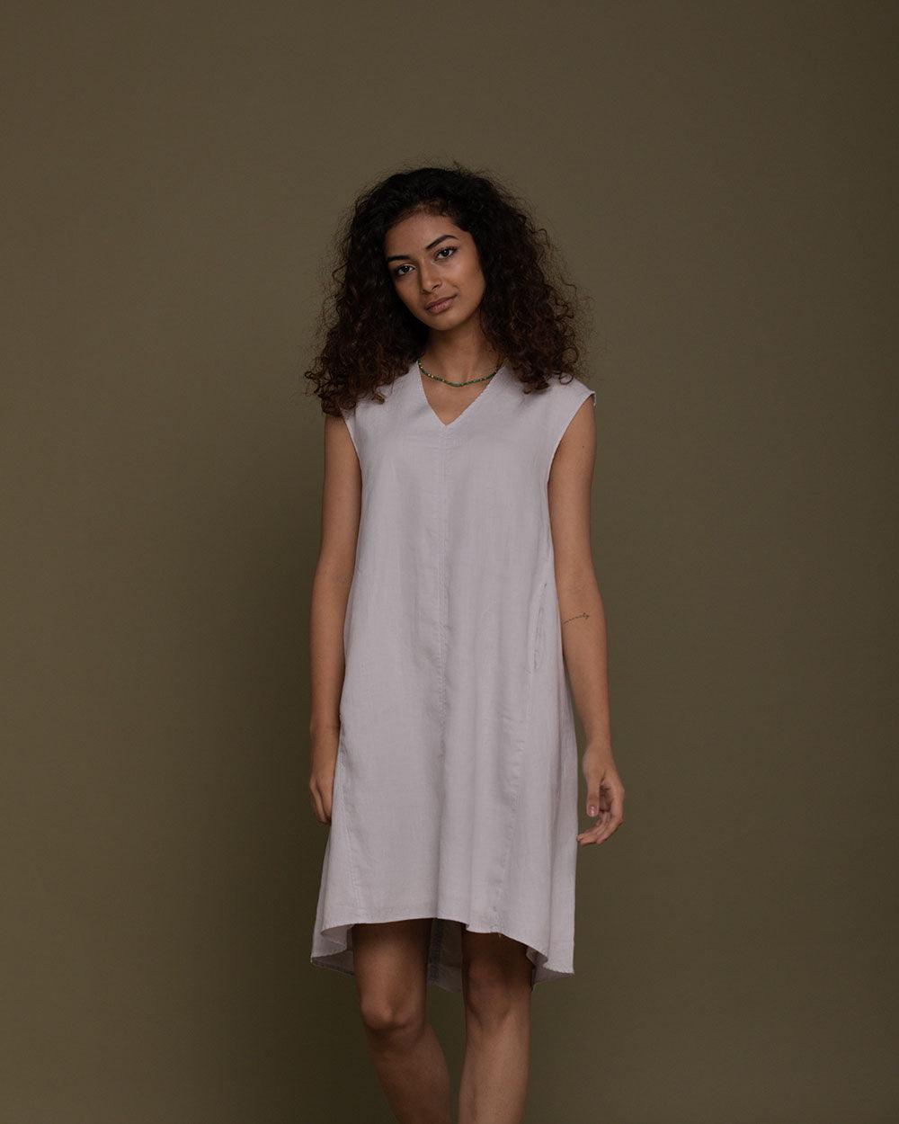 grey half sleeves v neck dress with side pockets.