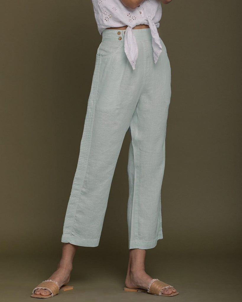 mint green ankle length hemp pants with pin tuck detailing on the sides.